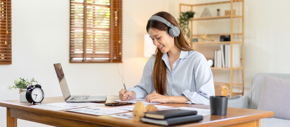 Woman at laptop impressing clients while working from home