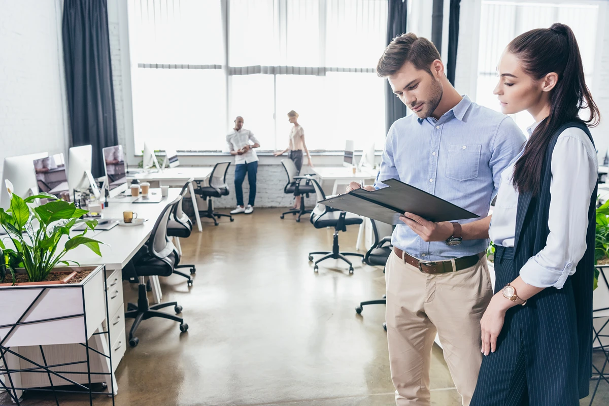 Two businesspeople choosing an office space